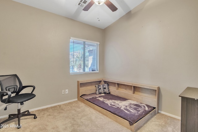 carpeted bedroom with lofted ceiling, a ceiling fan, visible vents, and baseboards