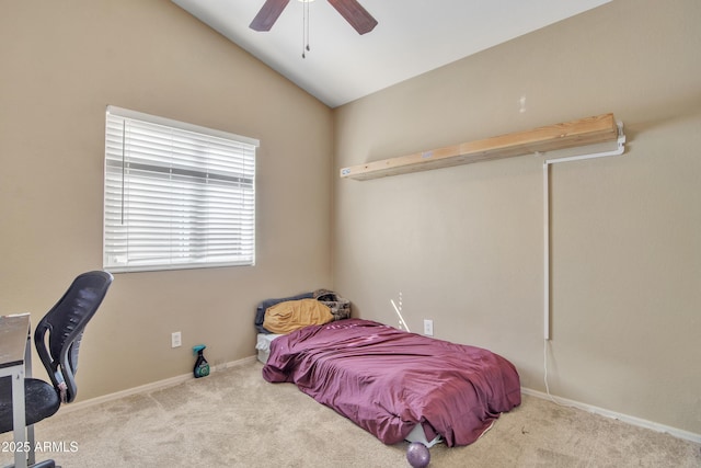 bedroom with carpet floors, lofted ceiling, baseboards, and a ceiling fan