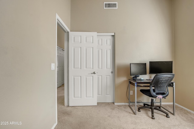 office with baseboards, visible vents, and carpet flooring