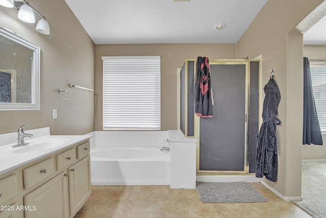 full bath featuring a garden tub, tile patterned flooring, a shower stall, and vanity