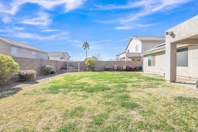 view of yard with a patio area and a fenced backyard