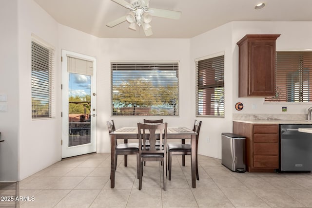 tiled dining area with ceiling fan