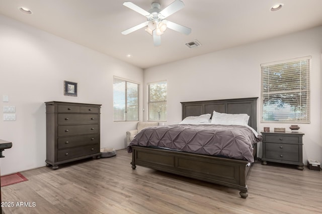 bedroom with light wood-type flooring and ceiling fan