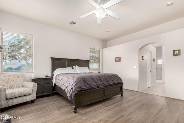 bedroom with ceiling fan and light wood-type flooring