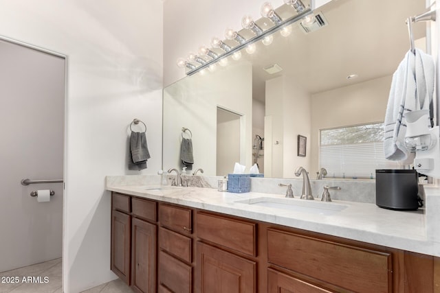 bathroom featuring tile patterned floors and vanity