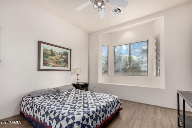 bedroom featuring ceiling fan and hardwood / wood-style floors