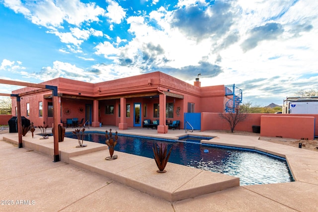 view of pool featuring a patio area and a grill