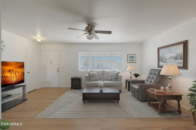 living room with ceiling fan and light hardwood / wood-style floors