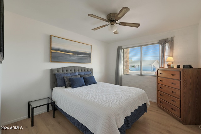 bedroom featuring ceiling fan and light hardwood / wood-style floors