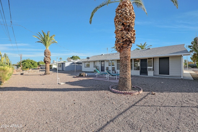 rear view of property with a patio area