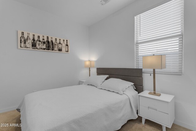 bedroom featuring carpet floors and baseboards