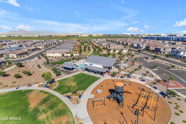 aerial perspective of suburban area with a mountainous background