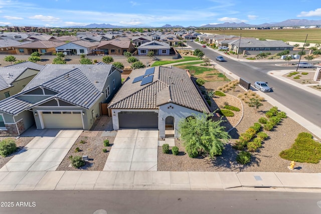 aerial view of residential area with a mountain backdrop