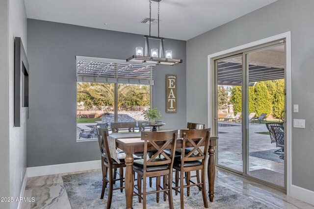 dining room with a chandelier