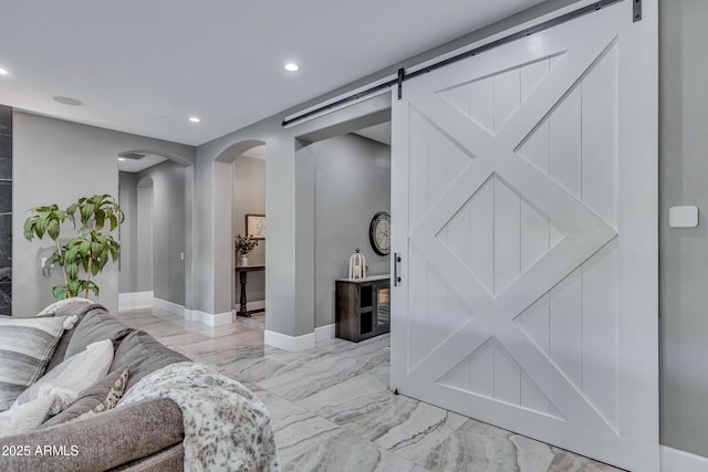 living room featuring a barn door