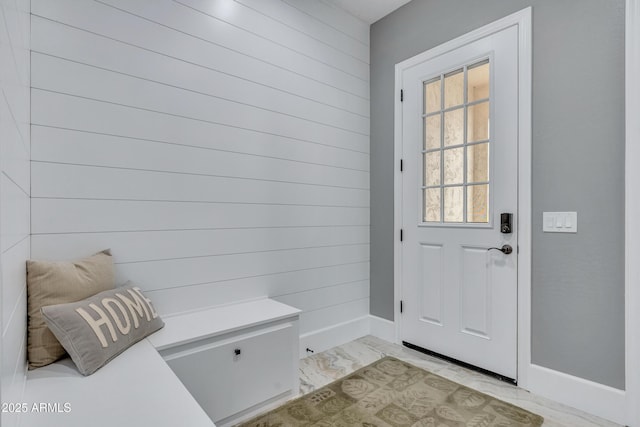 mudroom with wooden walls