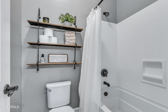 bathroom with shower / bath combo with shower curtain and toilet