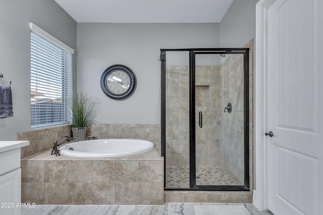 bathroom featuring separate shower and tub and vanity