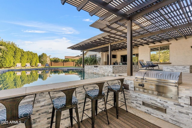 exterior space with a pergola, area for grilling, an outdoor bar, and grilling area