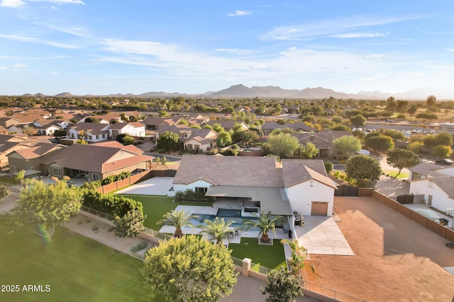 birds eye view of property with a mountain view