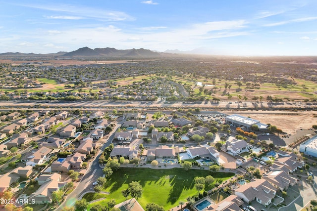 birds eye view of property featuring a mountain view