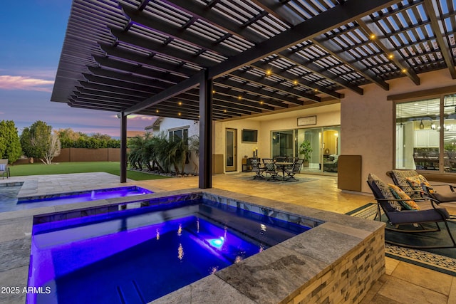 view of swimming pool featuring an in ground hot tub and a patio