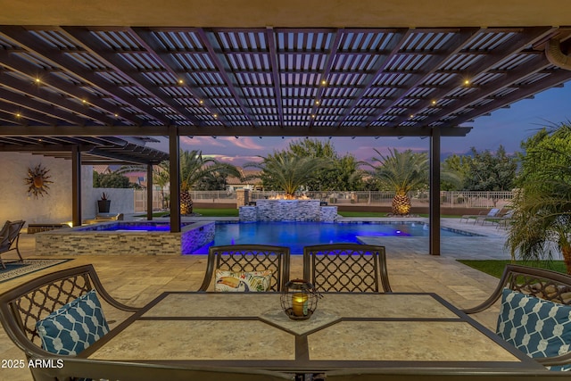 patio terrace at dusk with a pergola and a swimming pool with hot tub