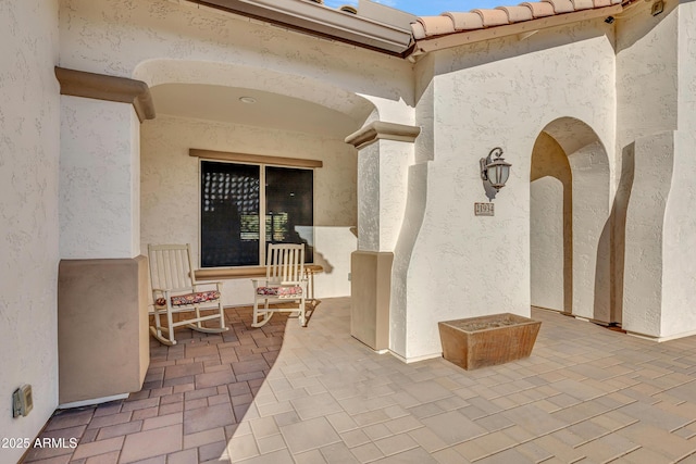 doorway to property with a patio area