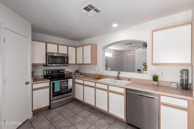 kitchen featuring a sink, light countertops, visible vents, and appliances with stainless steel finishes