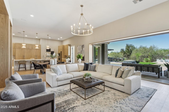 7032 E Balancing Rock Rd, Scottsdale, AZ 85266 - living area with a chandelier, light wood-type flooring, and recessed lighting