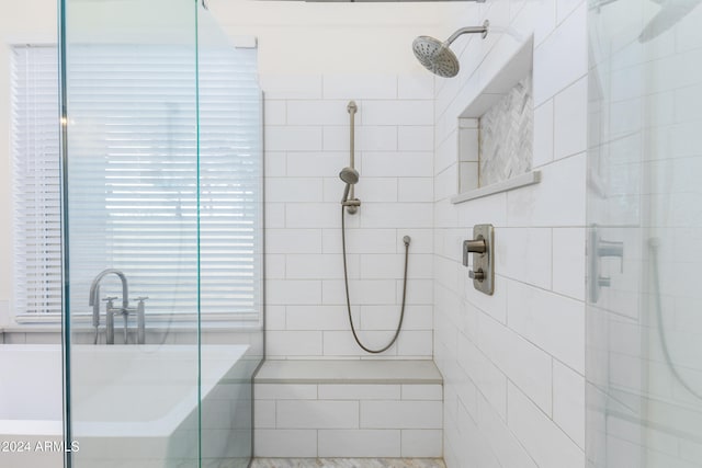 bathroom featuring a tile shower