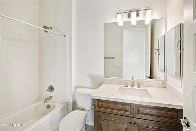 bathroom featuring toilet, bathing tub / shower combination, and vanity