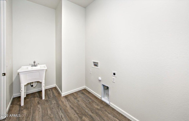 laundry room with laundry area, wood finished floors, baseboards, hookup for an electric dryer, and hookup for a gas dryer