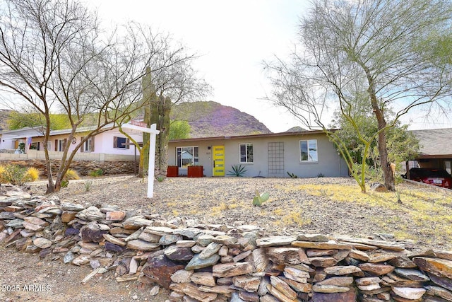 single story home featuring a mountain view