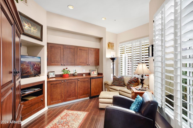 interior space featuring light countertops, dark wood-style flooring, brown cabinetry, and recessed lighting