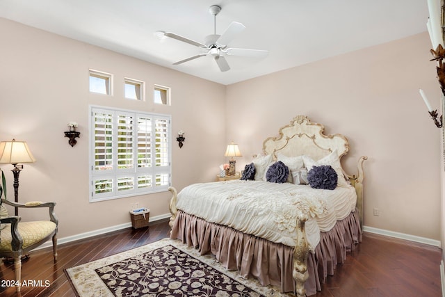 bedroom featuring dark wood-style floors, ceiling fan, and baseboards