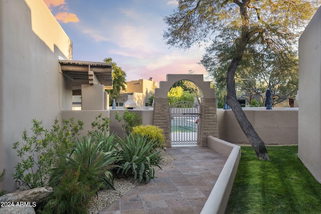 exterior space featuring a fenced front yard and a gate