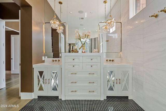 bathroom featuring tile walls and vanity