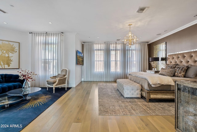 bedroom with crown molding, an inviting chandelier, and light hardwood / wood-style flooring