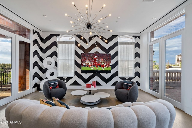 interior space featuring a notable chandelier, french doors, and hardwood / wood-style flooring