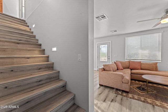 21647 W Laura St, Wittmann, AZ 85361 - staircase with wood finished floors and a ceiling fan