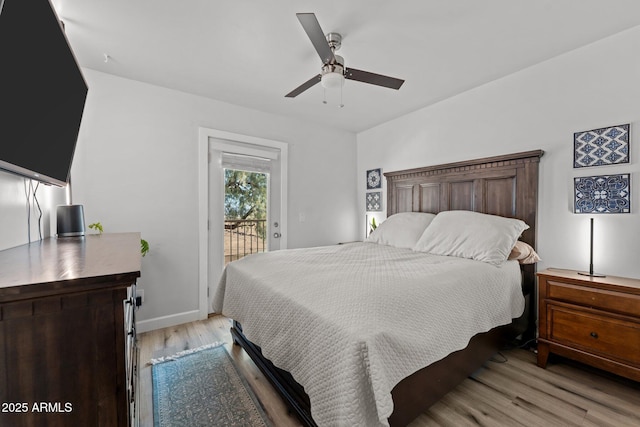 21647 W Laura St, Wittmann, AZ 85361 - bedroom featuring access to outside, light wood-style floors, and a ceiling fan