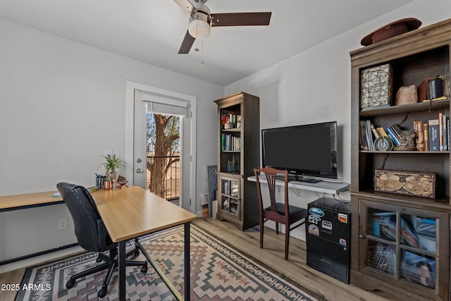 21647 W Laura St, Wittmann, AZ 85361 - office featuring wood finished floors and a ceiling fan
