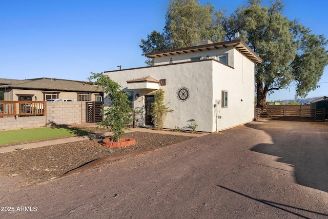 21647 W Laura St, Wittmann, AZ 85361 - view of front of property with stucco siding and a gate