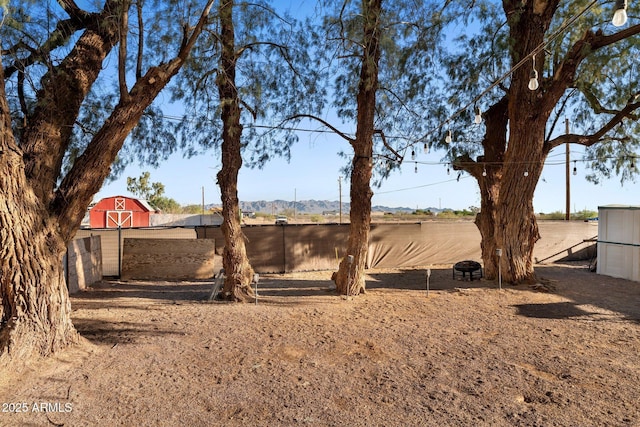 21647 W Laura St, Wittmann, AZ 85361 - view of yard with a barn, an outbuilding, and a mountain view