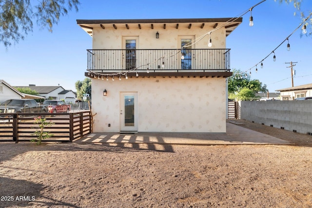21647 W Laura St, Wittmann, AZ 85361 - back of property with stucco siding and a balcony