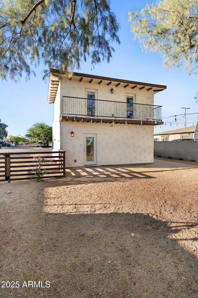 21647 W Laura St, Wittmann, AZ 85361 - back of property with stucco siding and a balcony
