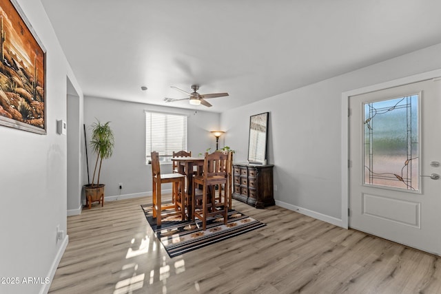 21647 W Laura St, Wittmann, AZ 85361 - dining space featuring light wood-style floors and ceiling fan