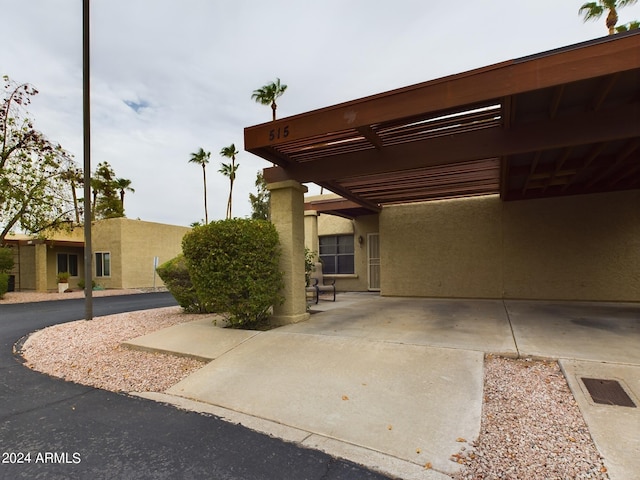 exterior space with a carport