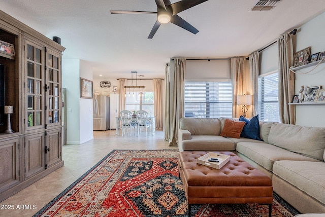1145 E Lowell Ave, Gilbert, AZ 85295 - living area featuring ceiling fan, plenty of natural light, and baseboards